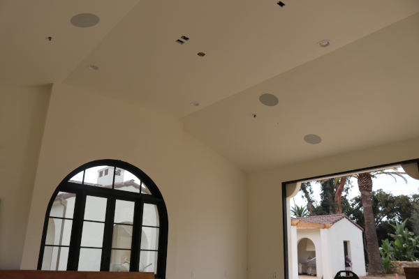 arched-black-framed-window-vaulted-ceiling