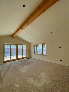 modern-bedroom-vaulted-ceiling-exposed-beam